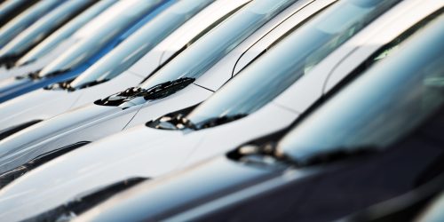 Row of Modern Cars. Car Dealership Parking Lot. Brand New Vehicles.